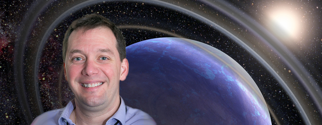Head-shot of Dr. Laurent Pueyo with an illustration of a ringed, blue exoplanet in the background