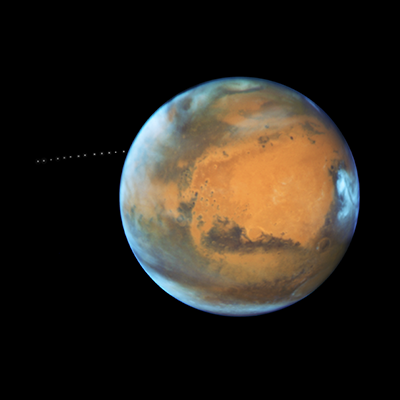 NASA's Hubble Sees Martian Moon Orbiting the Red Planet