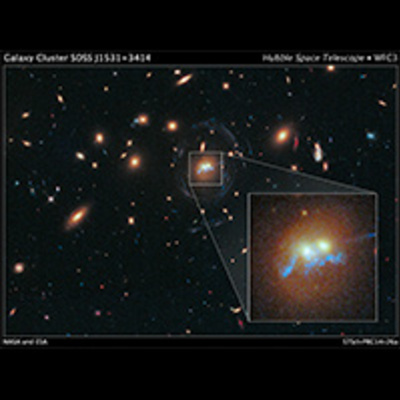 Hubble Sees Spiral Bridge of Young Stars Between Two Ancient Galaxies