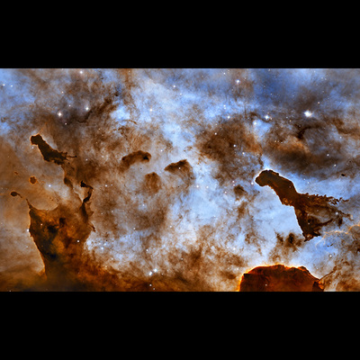 Cosmic Ice Sculptures: Dust Pillars in the Carina Nebula