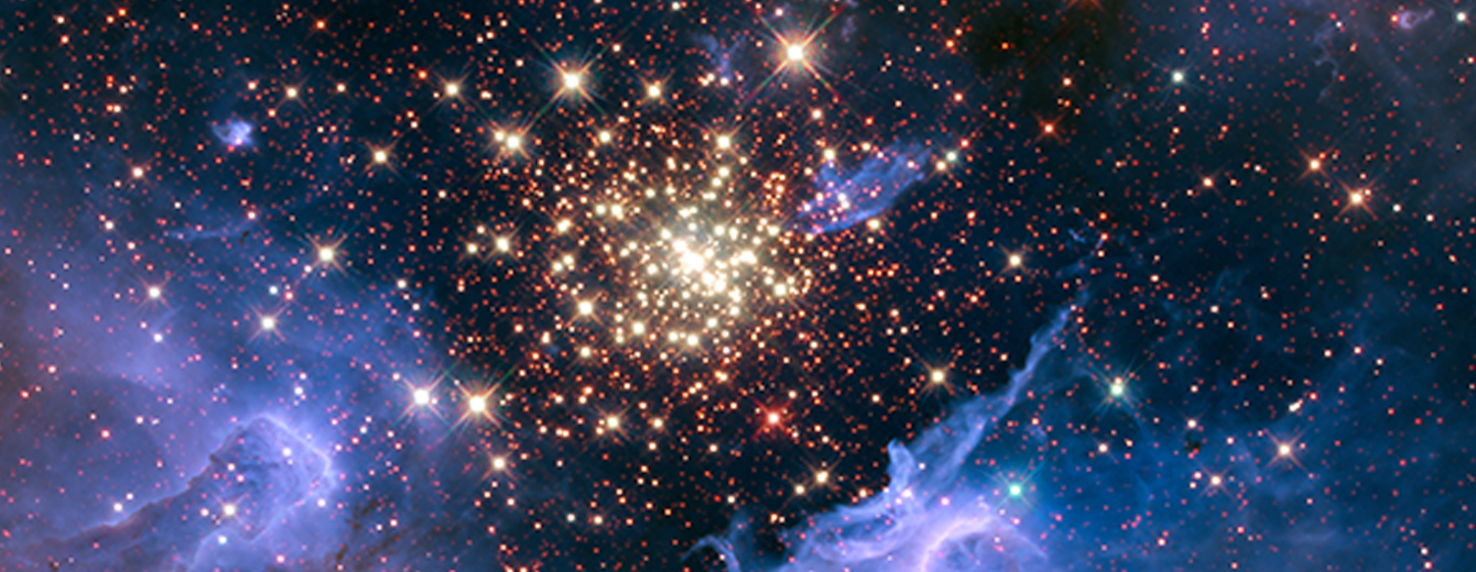 In the middle of the image is a circular cluster of yellow-white stars. Near the center of the cluster, the stars are so close together that they appear as an amorphous blob of yellow-white light. Moving away from the center, the stars are spread apart. The area above the cluster is tinted purple with smoke-like wisps. The majority of the image’s background is black, with small points of yellow-white and red stars scattered across. Toward the lower left and lower right are wave-like, luminescent purple clouds that cradle the bottom of the cluster.