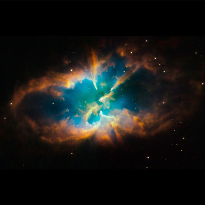 A roughly oval-shaped planetary nebula with three different layers.