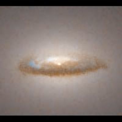 Dust Disk Around a Black Hole in Galaxy NGC 7052