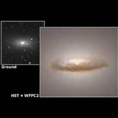 Dust Disk Surrounds a Massive Black Hole in Elliptical Galaxy NGC 7052