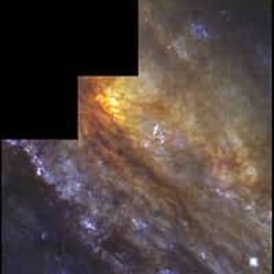 Edge-On Spiral Galaxy NGC 253: Behind a Dusty Veil Lies a Cradle of Star Birth