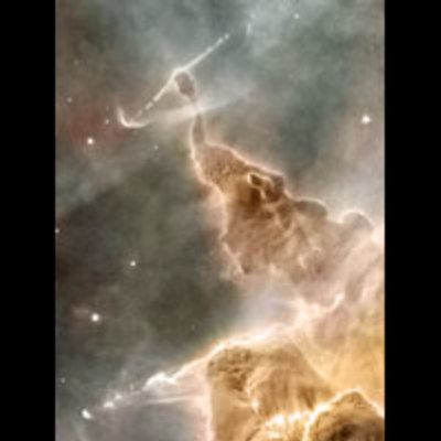 Strange-looking formations of gas and dust, eroded away by stellar winds and silhouetted by unseen stars, including an eroded pillar, has an almost reptilian appearance, with a body and thin neck, topped by a rounder head.