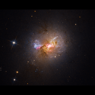 Hubble Finds a Black Hole Igniting Star Formation in a Dwarf Galaxy