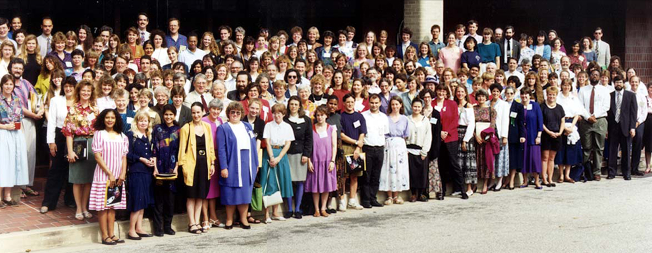 More than 100 'Women in Astronomy' meeting attendees stand on the front steps of the Space Telescope Science Institute