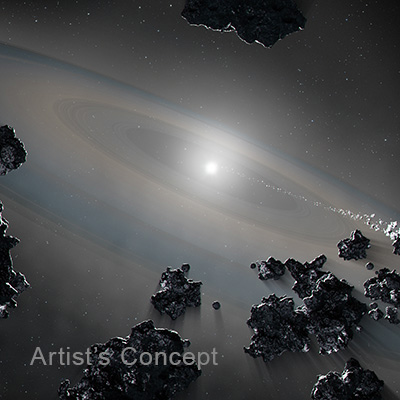 At image center is a small, white star against a gray background. It is surrounded by a large translucent disk with rings and gaps that extends from upper left to lower right. In the foreground, irregular chunky rocks are floating in space along the bottom of the frame. A stream of material extends from lower right toward the central star. The words, artist's concept are at lower left.