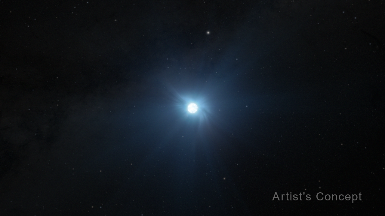 Illustration showing a small circular white object on the black background of space speckled with dim stars. The object is glowing, and rays of soft light emanate in all directions. The words “Artist’s Concept” are at the lower right.